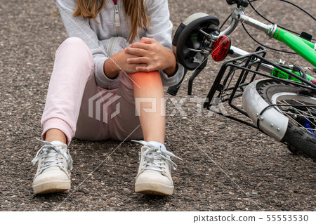 Girl in pain after a bicycle accident Girl in pain after a bicycle accident 55553530