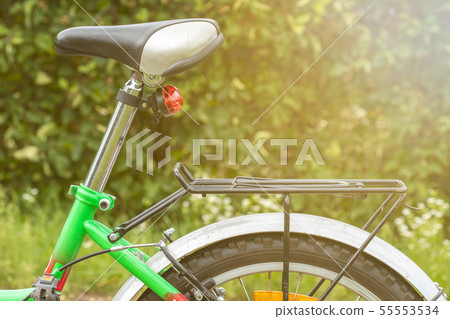 Bicycle saddle on the nature background Bicycle saddle on the nature background 55553534
