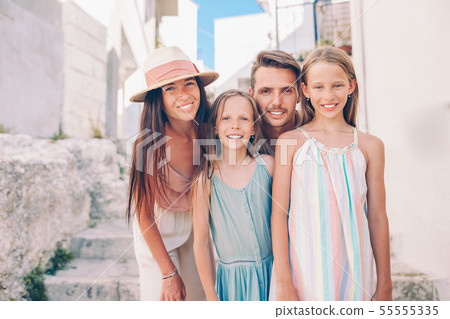 Family of parents and kids vacation in European vacation 55555335