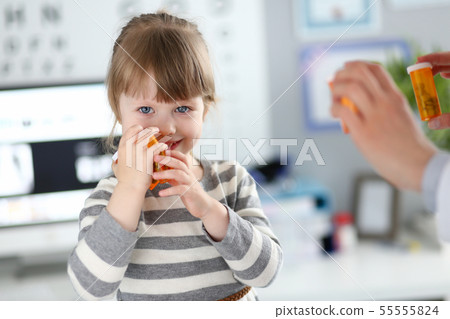 Cheerful little kid with doctor Cheerful little kid with doctor 55555824