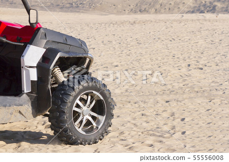 the ATV goes on desert sands to clear day 55556008