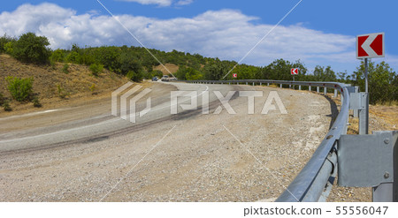 panorama of the twisting road in mountains 55556047