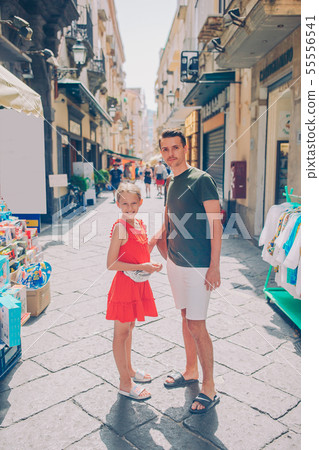 Happy mother and little adorable kid on cozy street during italian vacation. Happy mother and little adorable kid on cozy street during italian vacation. 55556541