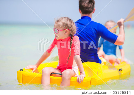 Little girls and young dad kayaking during summer vacation Little girls and young dad kayaking during summer vacation 55556814