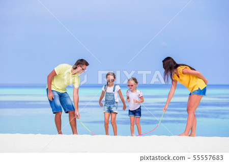 Young family on vacation have a lot of fun Young family on vacation have a lot of fun 55557683