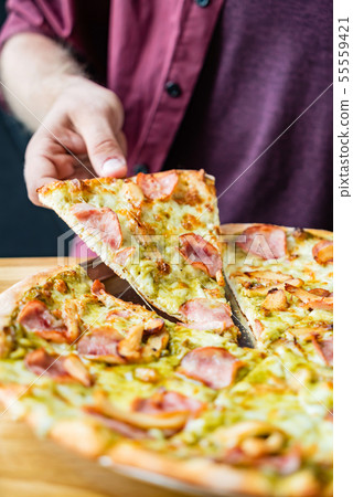man eating tasty italian pizza man eating tasty italian pizza 55559421