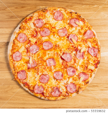 pizza on the wooden background pizza on the wooden background 55559632