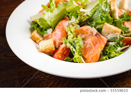 caesar salad with salmon fish 55559633