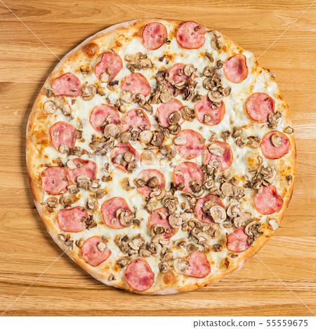 pizza on the wooden background 55559675