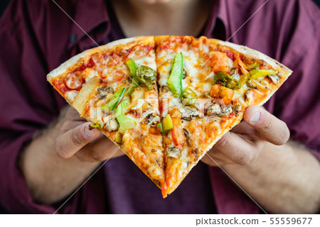 pizza on the wooden background 55559677