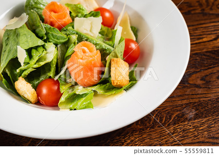 caesar salad with salmon fish 55559811