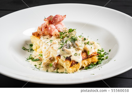 Potato babka is a savoury dish, popular especially in Belarus and Poland Potato babka is a savoury dish, popular especially in Belarus and Poland 55560038