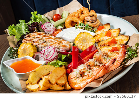 seafood plate on the wooden background seafood plate on the wooden background 55560137