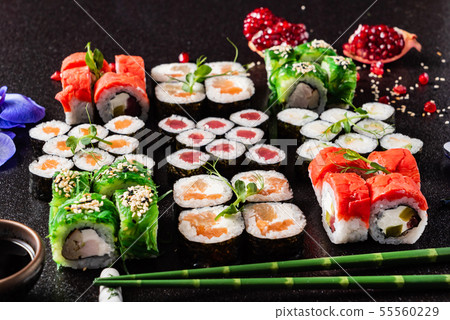 Rainbow Sushi Roll with salmon, eel, tuna, avocado, royal prawn, cream cheese Philadelphia Rainbow Sushi Roll with salmon, eel, tuna, avocado, royal prawn, cream cheese Philadelphia 55560229