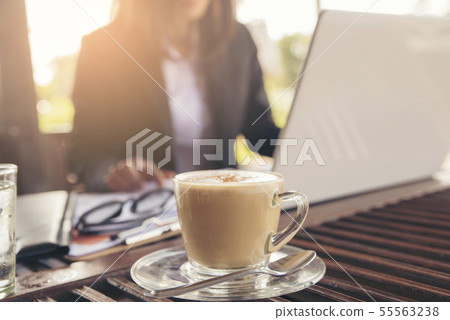 Coffee time, beautiful woman using mobile phone in 55563238