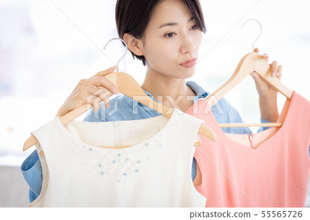 Woman hanger clothes selection 55565726