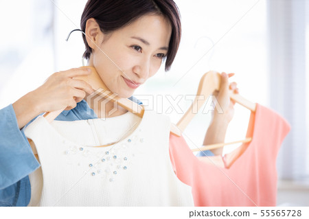 Woman hanger clothes selection 55565728