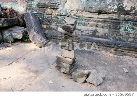 A column of pebbles among the ancient ruins. A column of pebbles among the ancient ruins. 55569597