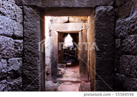Corridor and doorway of an old stone building. Corridor and doorway of an old stone building. 55569598