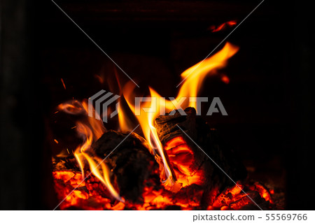 Fire is red in a closed oven on black background. Fire is red in a closed oven on black background. 55569766