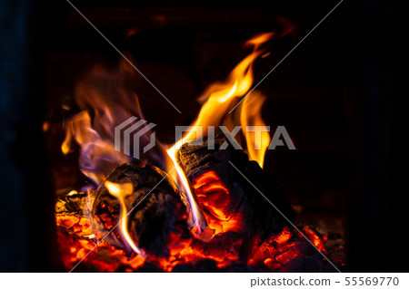 Fire is red in a closed oven on black background. Fire is red in a closed oven on black background. 55569770