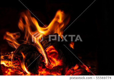 Fire is red in a closed oven on black background. Fire is red in a closed oven on black background. 55569774