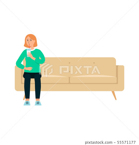 Single Woman With Beverage Sitting On Couch Stock