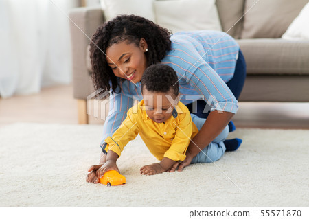 mother and baby playing with toy car at home mother and baby playing with toy car at home 55571870