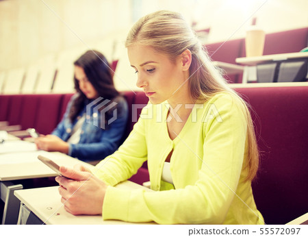 student girls with smartphones on lecture student girls with smartphones on lecture 55572097