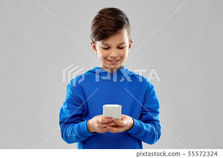 smiling boy in blue hoodie 55572324
