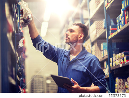 auto mechanic or smith with tablet pc at workshop 55572373