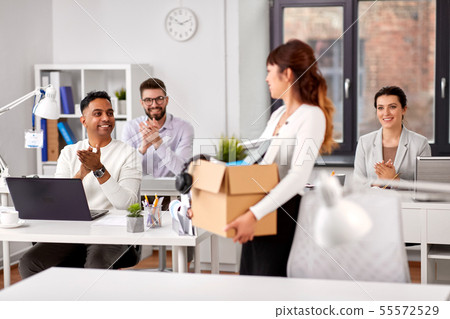 colleagues applauding to new female office worker 55572529