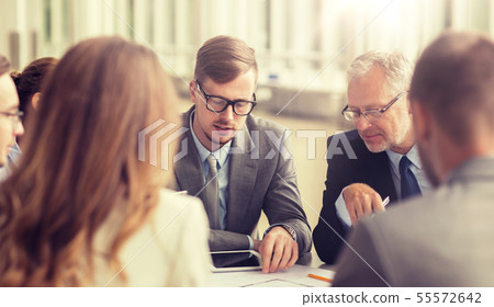 architects with blueprint and tablet pc at office architects with blueprint and tablet pc at office 55572642