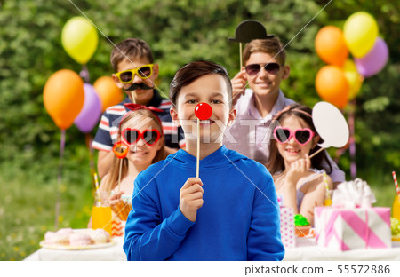 happy boy with red clown nose at birthday party happy boy with red clown nose at birthday party 55572886