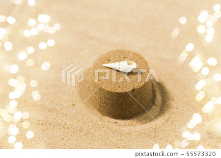 sand shape made by mold with shell on summer beach 55573320