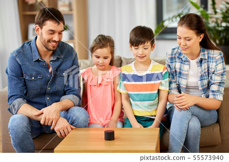 happy family with smart speaker at home happy family with smart speaker at home 55573940