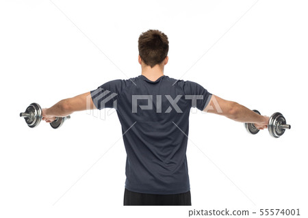young man with dumbbells exercising young man with dumbbells exercising 55574001