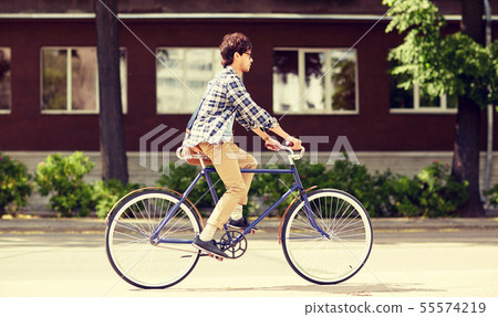 young hipster man with bag riding fixed gear bike 55574219