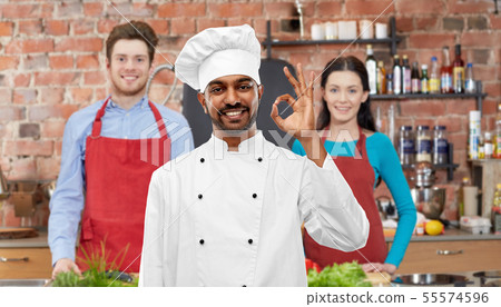 happy male indian chef showing ok at cooking class happy male indian chef showing ok at cooking class 55574596