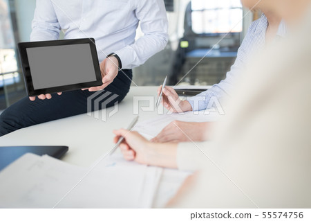 close up of business team with tablet pc at office 55574756