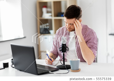audio blogger with laptop, microphone and notebook 55575339