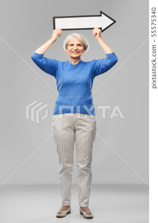 smiling senior woman with big rightwards arrow 55575340