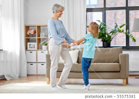 grandmother and granddaughter having fun at home grandmother and granddaughter having fun at home 55575381