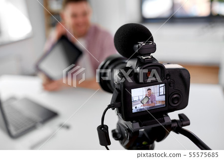 camera recording video blogger with tablet pc 55575685