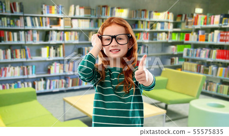 red haired student girl in glasses at library 55575835