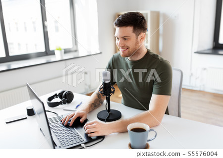 blogger with laptop and microphone audio blogging 55576004