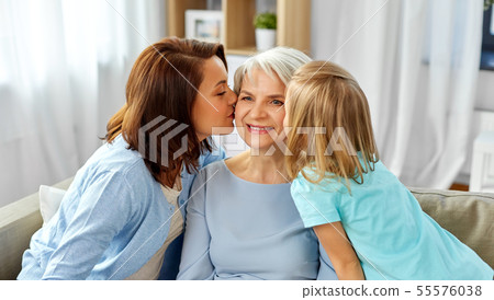 mother and daughter kissing happy grandmother mother and daughter kissing happy grandmother 55576038