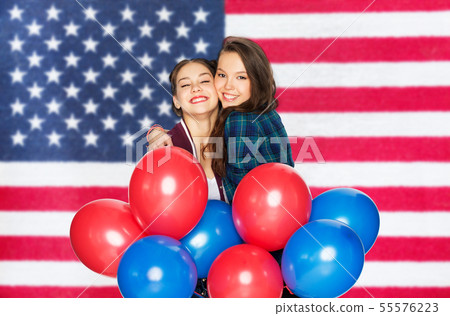 teenage girls with balloons over american flag teenage girls with balloons over american flag 55576223