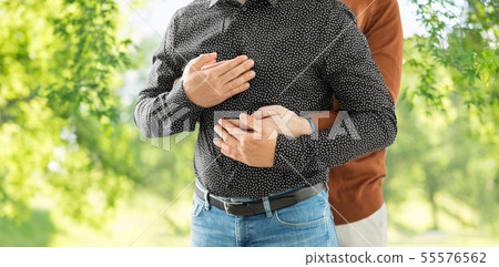 close up of hugging male gay couple 55576562