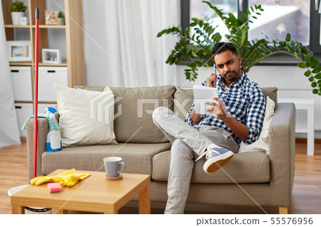 indian man making to do list after home cleaning indian man making to do list after home cleaning 55576956
